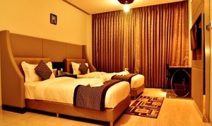 Hotel A K International in Hazaribagh, image may contain: Interior Design, Indoors, Home Decor, Furniture