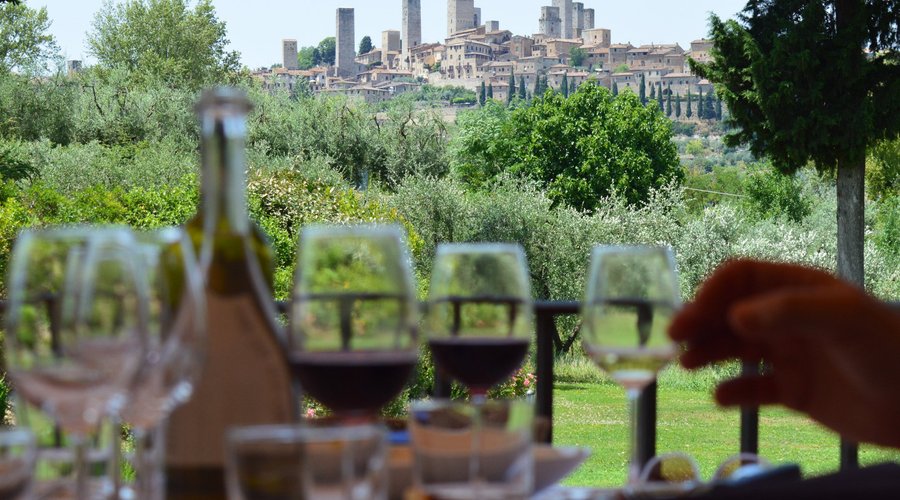 Wine tasting with San Gimignano's skyline on the background