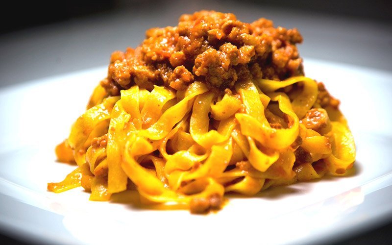 Handmade gluten-free tagliatelle with bolognese ragù sauce 