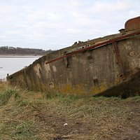A concre barge well beached
