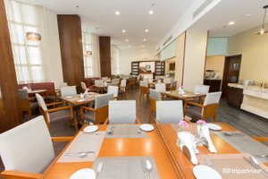 Lavender Hotel Deira in Dubai, image may contain: Dining Room, Dining Table, Restaurant, Cafeteria