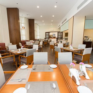 Lavender Hotel Deira in Dubai, image may contain: Dining Room, Dining Table, Restaurant, Cafeteria