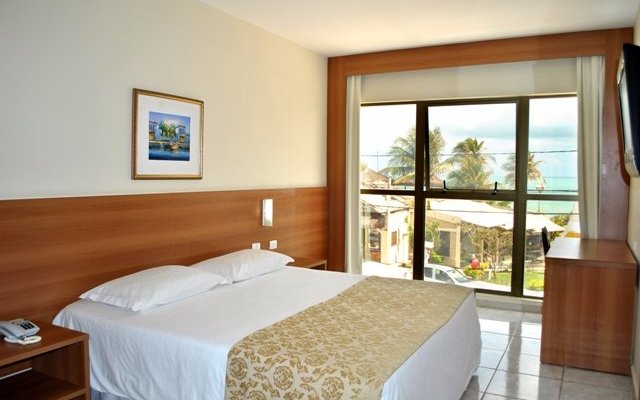 Quarto Luxo com vista do mar.