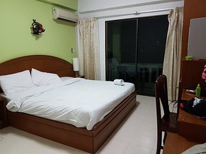 Phuket Holiday Hostel in Phuket, image may contain: Bed, Furniture, Chair, Bedroom