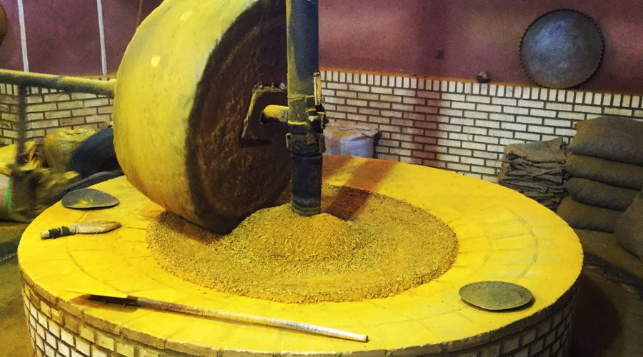Grinding Turmeric - Grand Bazar