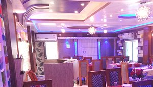 Hotel Sagar in Siuri, image may contain: Lighting, Restaurant, Dining Room, Dining Table