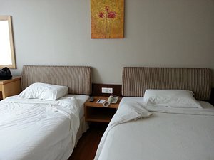 Kingwood Hotel Mukah in Mukah, image may contain: Dorm Room, Furniture, Bed, Handbag