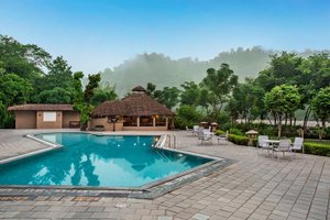 The Riverview Retreat - Corbett Resort by Leisure Hotels Group in Jim Corbett National Park, image may contain: Resort, Hotel, Villa, Pool