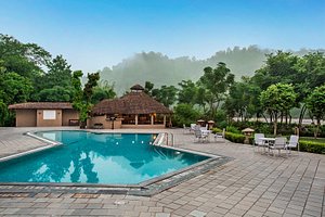 The Riverview Retreat - Corbett Resort by Leisure Hotels Group in Jim Corbett National Park, image may contain: Resort, Hotel, Villa, Pool