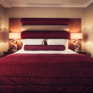 Carlton George Hotel in Glasgow, image may contain: Furniture, Bed, Cushion, Bedroom