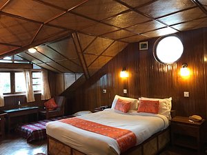 Norbu Ghang Resort in Pelling, image may contain: Loft, Housing, Bed, Lighting