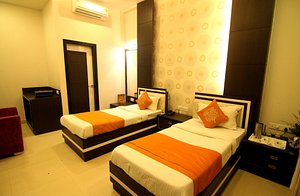 Hotel Rivera Palace in Varanasi, image may contain: Bed, Furniture, Bedroom, Room