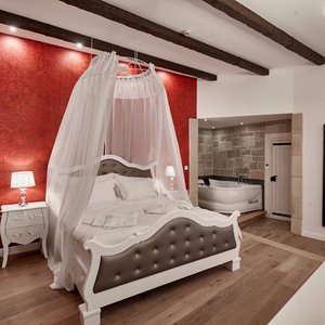 Maison Bistro & Hotel in Budapest, image may contain: Chandelier, Lamp, Home Decor, Interior Design