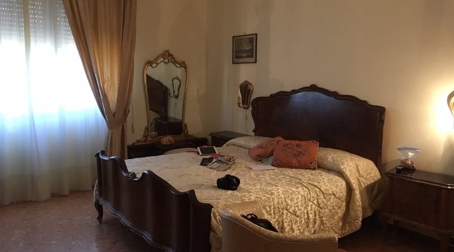 The big bedroom. To the left (out of frame) is armoire, to the right is dresser.