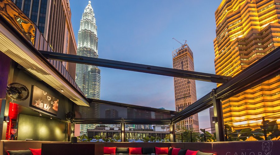 A lounge area with comfortable seating and great views of the Petronas Towers.