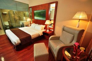 Sunlight Hotel Puerto Princesa in Palawan Island, image may contain: Lamp, Bed, Chair, Table Lamp