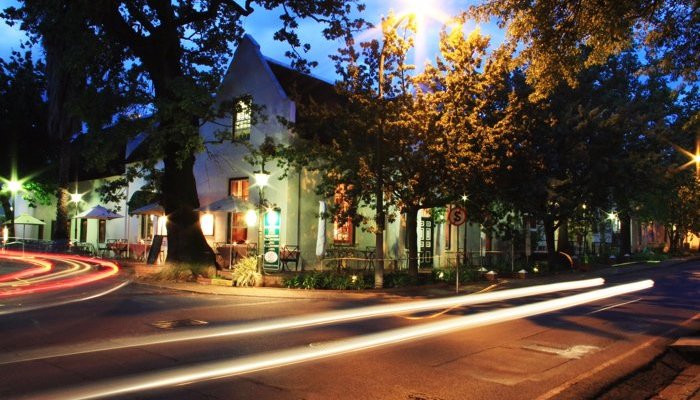 View of the Stellenbosch Kitchen and The Stellenbosch Hotel from Dorp Street at night.