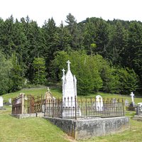Quiet little charming cemetery at the base of the mountain.