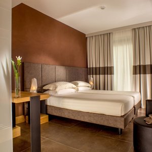 Best Western Plus Hotel Spring House Rome in Rome, image may contain: Hotel, Book, Resort, Furniture