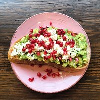 Avocado, feta and pomegranate on toast