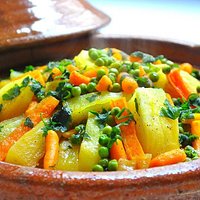 Moroccan Tagine of Beef and vegetables: Carrotes, Potatoes, and Greeen Peas.