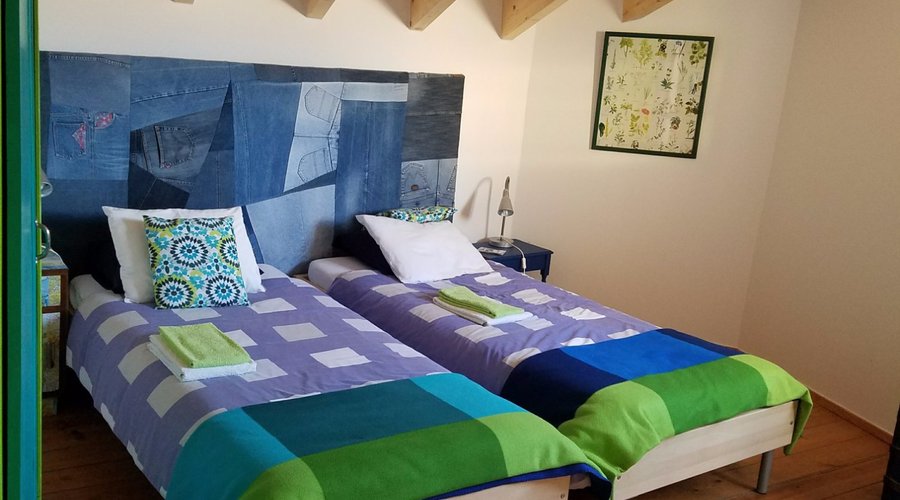 Our bedroom with gorgeous vaulted wood ceilings.
