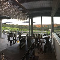 Look out of cellar door and the end of the day as the sun sets on the mountains