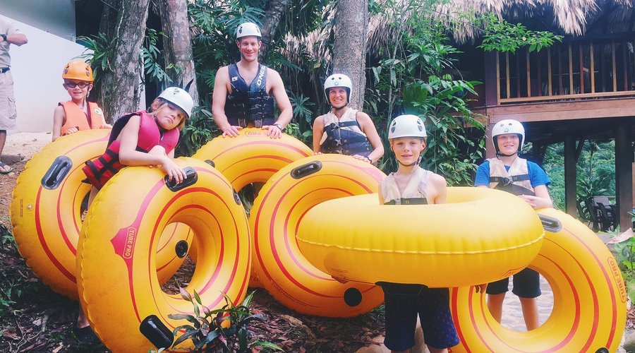 Family river tubing down the Macal River