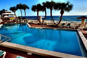 Palmetto Inn & Suites in Panama City Beach, image may contain: Hotel, Resort, Pool, Summer