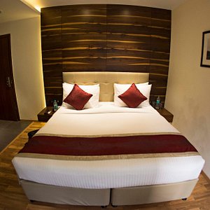 Hotel Connaught Royale in New Delhi, image may contain: Interior Design, Indoors, Wood, Bed