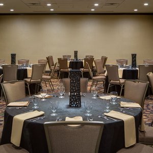 Embassy Suites by Hilton Dallas Love Field in Dallas, image may contain: Chair, Furniture, Bedroom, Room