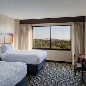Embassy Suites by Hilton Dallas Love Field in Dallas, image may contain: Chair, Furniture, Bedroom, Room