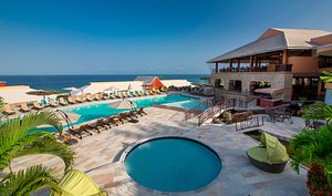 Le Grand Courlan Spa Resort in Tobago, image may contain: Hotel, Resort, Villa, Pool
