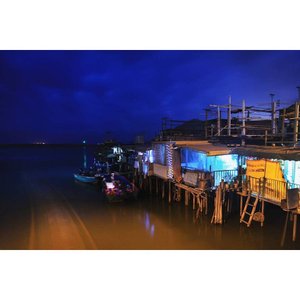 Enchanting night view of stilt houses