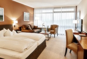 Hotel Bavaria Zwiesel in Zwiesel, image may contain: Home Decor, Couch, Living Room, Chair