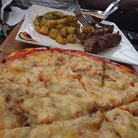 Delicous seafood pizza, tastes much better than it looks and tender lamb + aromatic herbed spuds
