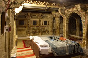 Hotel Suraj in Jaisalmer, image may contain: Bedroom, Furniture, Indoors, Bed