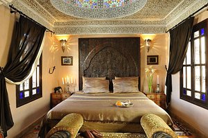 Riad Ibn Battouta in Fes, image may contain: Furniture, Bedroom, Indoors, Home Decor