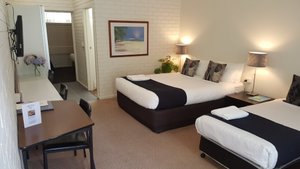 Prom Country Lodge in Foster, image may contain: Chair, Furniture, Bed, Bedroom