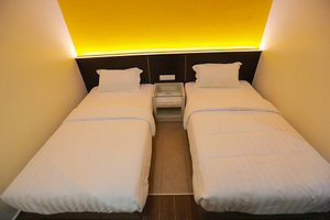 Pantai Regal Hotel in Kuantan, image may contain: Bed, Furniture, Hostel, Housing