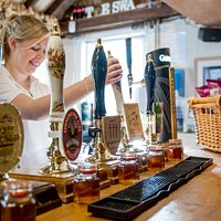 Jemma pulling a pint