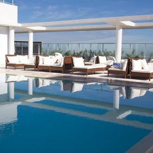 Dazzler by Wyndham Asuncion in Asuncion, image may contain: Pool, Swimming Pool, Villa, Couch