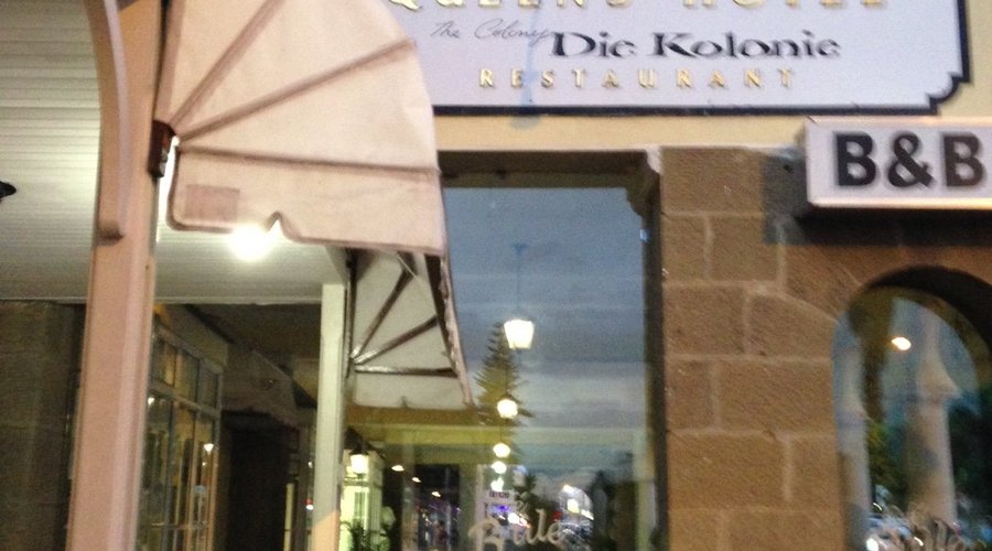 Entrance is to the left under canopy