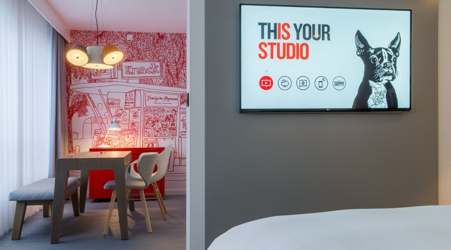 Guest room with 55" TV screen, sound bar & wireless streaming technology, Radisson RED Brussels