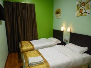 G Home in Kota Bharu, image may contain: Lamp, Bed, Furniture, Hostel