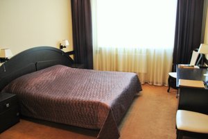 Arena Hotel in Minsk, image may contain: Furniture, Bedroom, Bed, Indoors