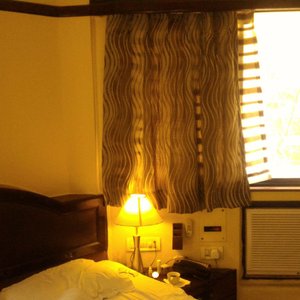 Lytton Hotel in Kolkata (Calcutta), image may contain: Bed, Couch, Painting, Lamp
