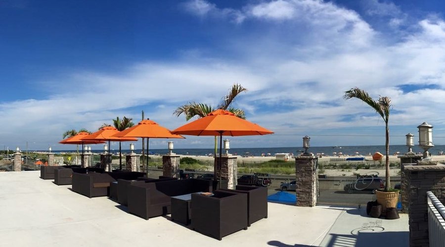 Soak in the sun on the Ocean Club Hotel's spacious sundeck - overlooking Cape May's famed beach