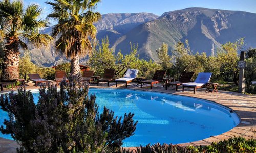 The pool area with mountain backdrop