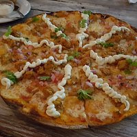The Butter Chicken Curry Pizza, thin base, delicious